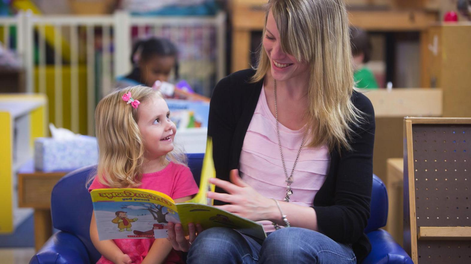 Teacher in the Child Development Center reading to a child